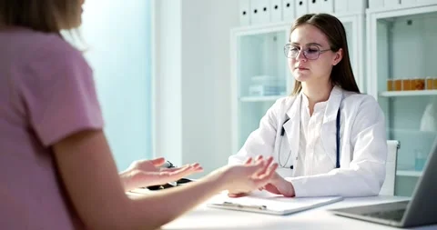 The Process of Doctor Patient Consultation Held in a Modern Medical Office Stock Footage 294383589