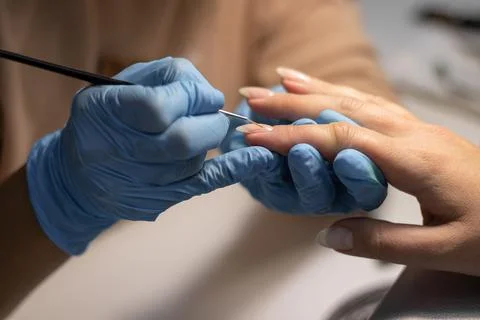 The process of doing a manicure in a spa salon. Stock Photos