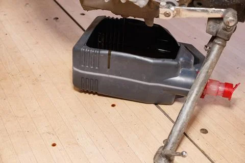 The process of draining oil from a motorcycle engine. Engine oil upgrade. Stock Photos