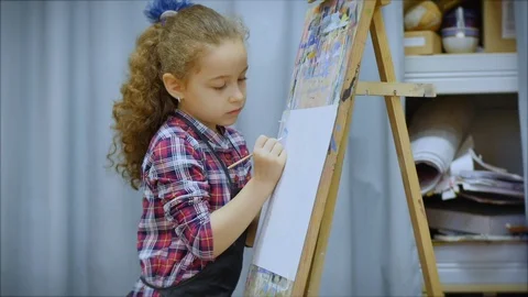 Process of Drawing: in Artist's Art Studio Hand Baby Girl Sketching on Canvas. Video stock 123776560