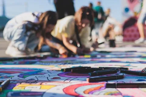 Process of drawing on asphalt and pavement, kids and children with crayons,.. Fotos de archivo