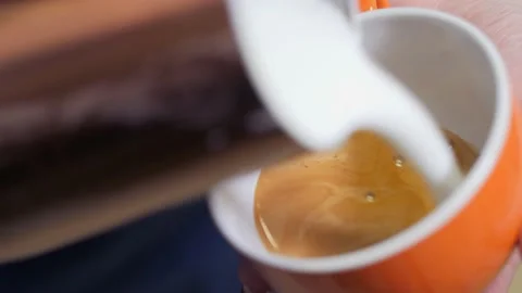 Process of drawing a flower on coffee, the camera is in motion.Latte art for Stock Footage 194732305