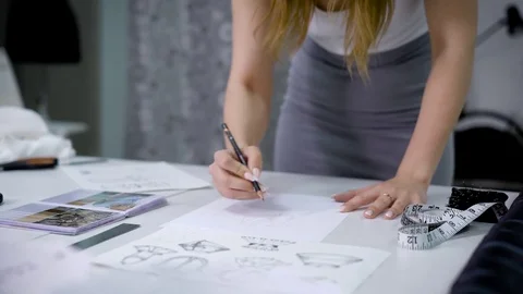 Process of drawing new sketch for designers wear. Stock-Footage 77541451