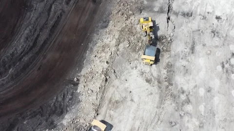The process of dredging and loading soil into trucks to make hauling roads .. Stock Footage 314271281