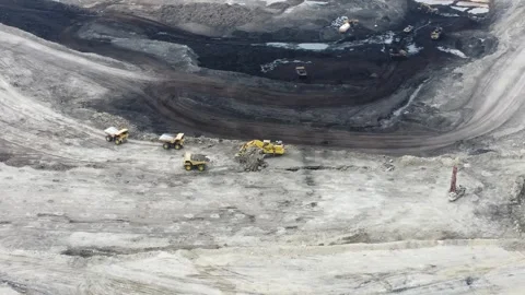 The process of dredging and loading soil into trucks to make hauling roads .. Stock Footage 314271316