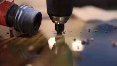 Process of drilling holes in a new epoxy wood table Stock Footage 152725997