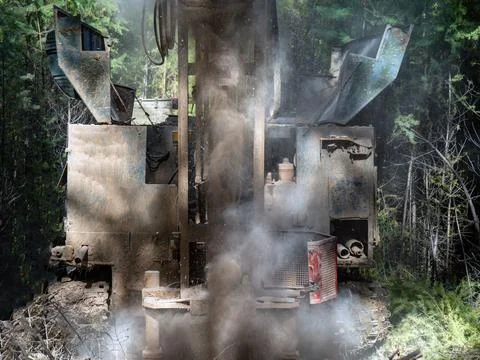 The process of drilling a well with a small-depth drilling rig. There is a lot Stock Photos