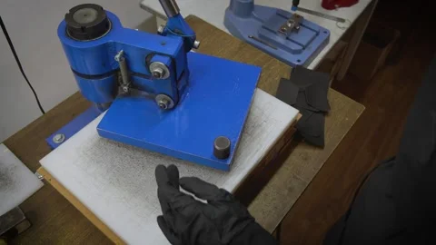 The process of embossing a logo on leather Stock Footage 266139306