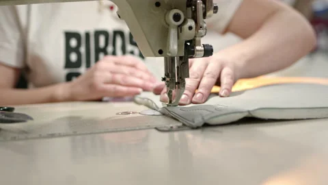 Process of embroidering diamond pattern on cowhide in atelier for helicopter or Stock Footage 174841247