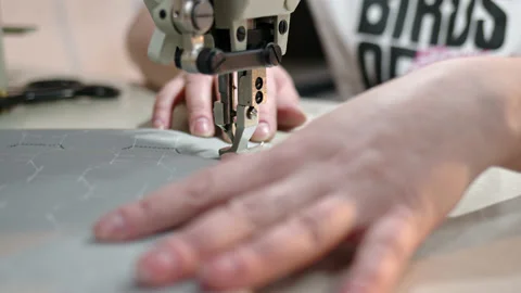 Process of embroidering diamond pattern on cowhide in atelier for helicopter or Stock Footage 175288538