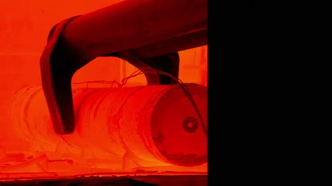 Process of excavation of metal hot red blank from furnace at mechanical plant. Stock Footage 160630474