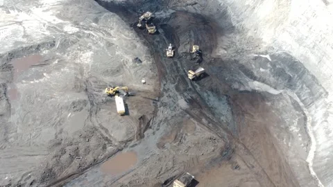 The process of an excavator loading coal onto a truck to be taken to the pr.. Stock Footage 314272195