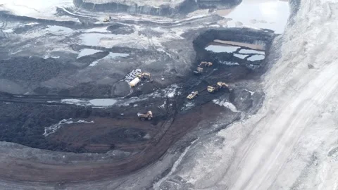 The process of an excavator loading coal onto a truck to be taken to the pr.. Stock Footage 314272314