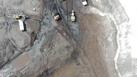 The process of an excavator loading coal onto a truck to be taken to the pr.. Stock Footage 314272357