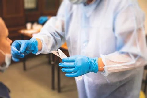 Process of express fast coronavirus testing examination by medic, COVID-19 sw Stock Photos