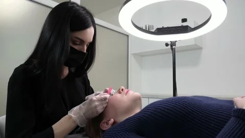 Process of extension eyelashes Stock Footage 148556765