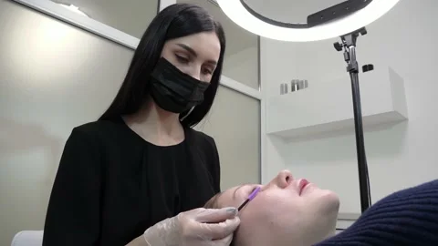 Process of extension eyelashes Stock Footage 149666854