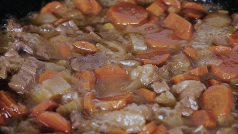 The process of extinguishing beef with vegetables close-up Stock Footage 102777176