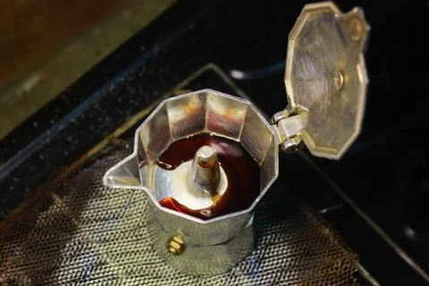 The process of extracting coffee into espresso using mocha pots, boiling wate Stock Photos