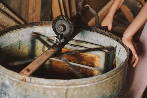 The process of extracting honey from bee honeycombs Stock Photos