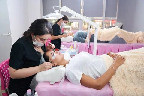 Process of eyelash extensions in the beauty studio Stock Photos