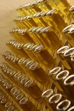 Process of fermentation of cider in bottles in special wooden racks Stock Photos