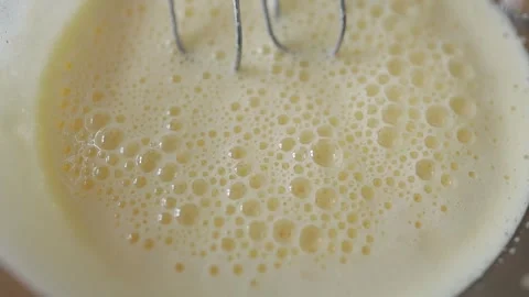 The process of fermentation of milk and yeast for baking bread close-up. Stock Footage 240759053