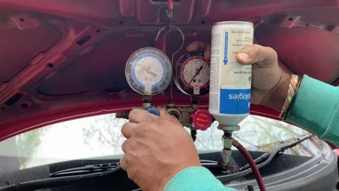 The process of filling the car air-conditioning gas. AC gas charging Video stock 167515705