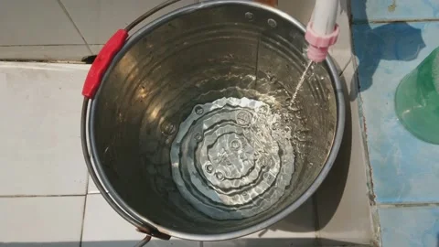 The Process of Filling Water into the Bucket Stock Footage 158984480