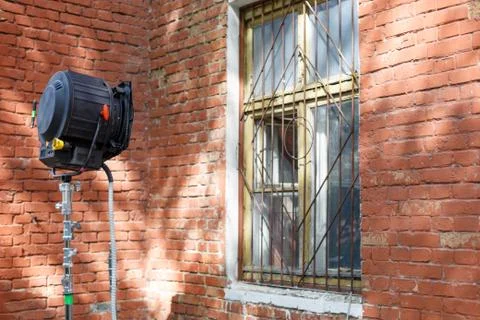 Process of filming. Spotlight illuminates window. Stock Photos