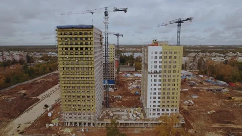 The process of finishing buildings in a cradle Stock Footage 317716982