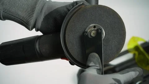 The process of fixing disk for cutting on angle grinder on white background Stock Footage 287244486