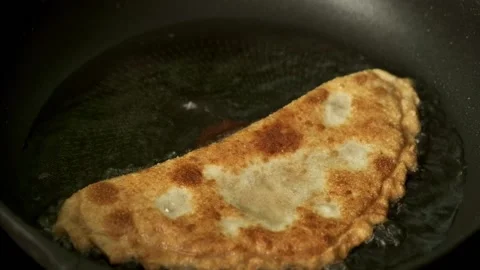Process with fried homemade chebureks Stock Footage 172430824