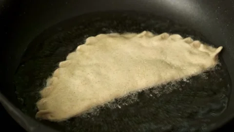 Process with fried homemade chebureks or qutab or calzone Stock Footage 174444238