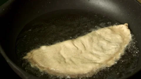 Process with fried homemade chebureks or qutab or calzone Stock Footage 177932695