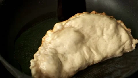 Process with fried homemade chebureks or qutab or calzone Stock Footage 189037792