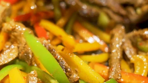 The Process of Frying and Stewing Traditional Mexican Fajitas from Beef and Vege Stock-Footage 125692874