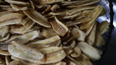 The process of frying banana chips Stock Footage 304846314