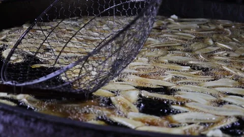 The process of frying banana chips Stock Footage 304848232