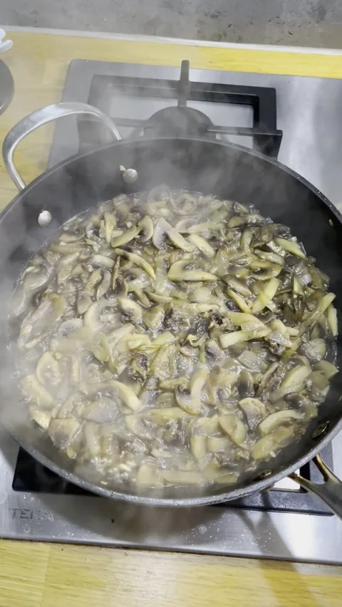 The process of frying champignon mushrooms in a pan Video stock 329422958