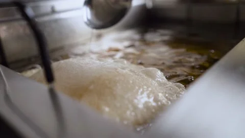 The process of frying chebureks in a restaurant. Video stock 190379658