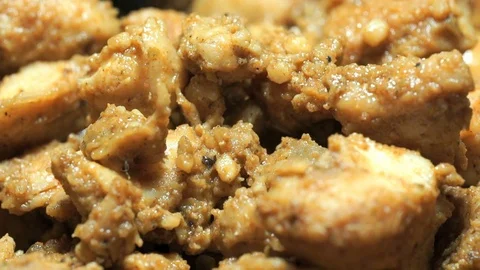 Process of frying chopped chicken pieces. Close-up 스톡 동영상 77634516