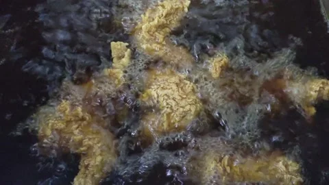 The process of frying crispy chicken in the fryer. Stock Footage 233422789