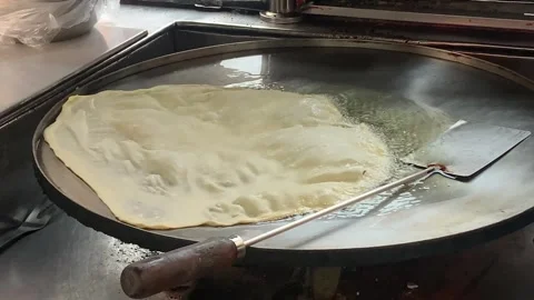 The Process of Frying Egg Martabak from Flour Dough (Traditional Indonesian Food Video stock 291258558