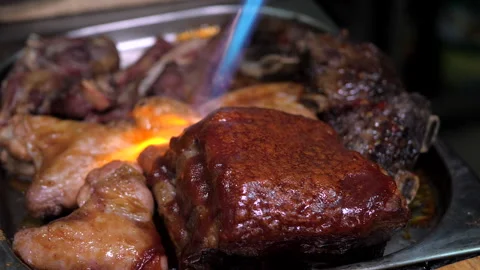 Process of frying a juicy appetizing steak with fire. Stock Footage 149819153