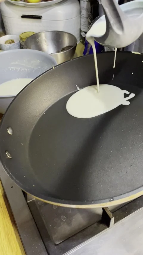 The process of frying pancakes in a pan Video stock 329423033