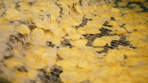 Process of frying potato chips on a fact... | Stock Video | Pond5