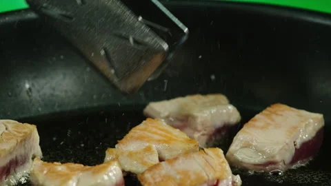 Process of frying raw pork slices using vegetable oil Stock Footage 260166622