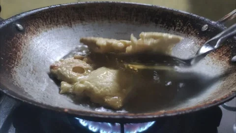 The Process of Frying Tempeh Stock Footage 296207662