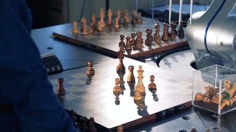 The process of game between chess player and robot. Stock Footage 87263464